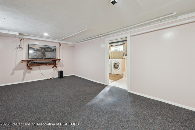 basement with washer and dryer and light carpet