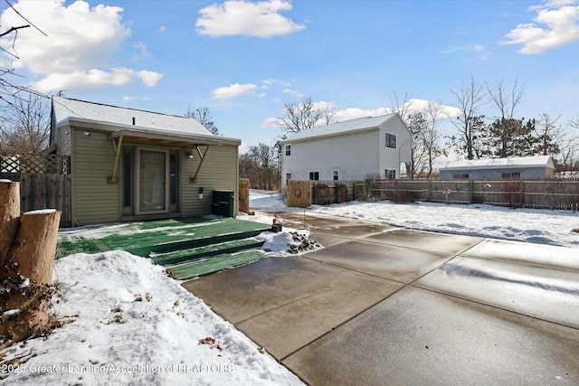 view of snow covered house