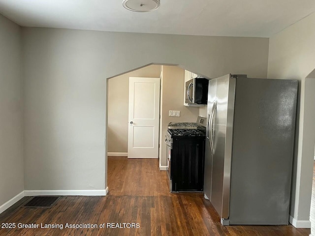 kitchen featuring dark hardwood / wood-style floors and appliances with stainless steel finishes