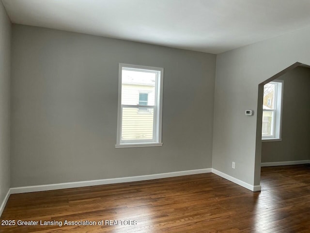 empty room featuring dark hardwood / wood-style floors