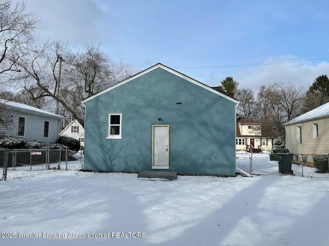 view of snow covered house