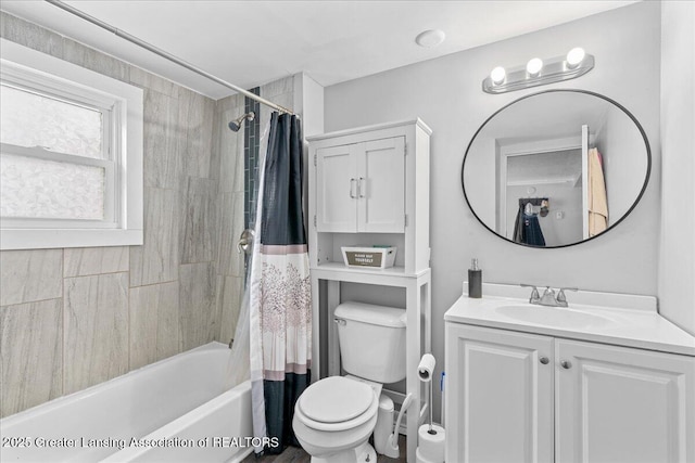 full bathroom with shower / tub combo with curtain, vanity, and toilet