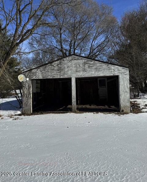 view of snow covered garage