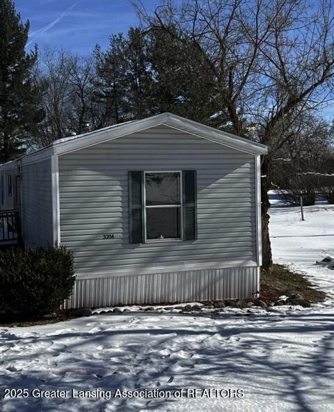 view of snow covered property