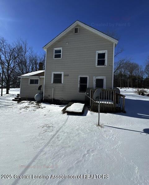 view of snow covered house