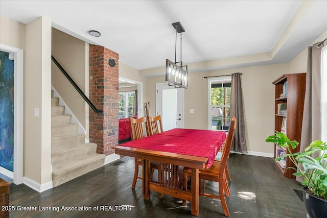 dining room with dark wood-type flooring