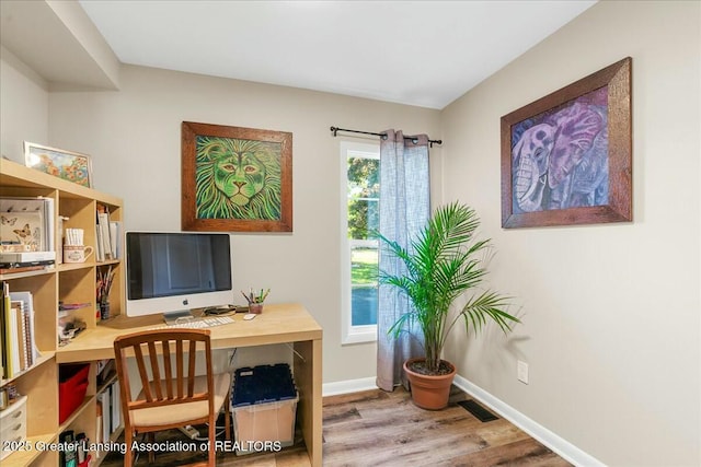 office area with hardwood / wood-style floors