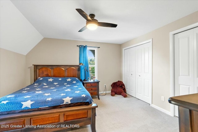 carpeted bedroom with lofted ceiling, ceiling fan, and a closet