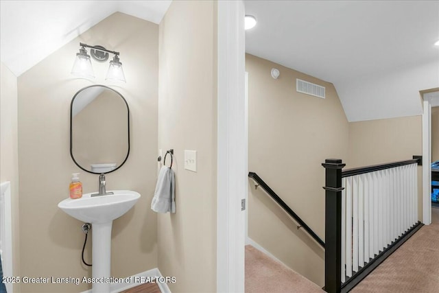 bathroom with vaulted ceiling