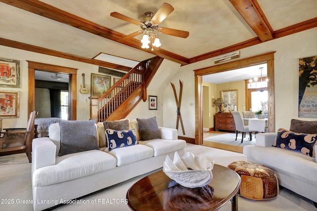 living room with beam ceiling and ceiling fan