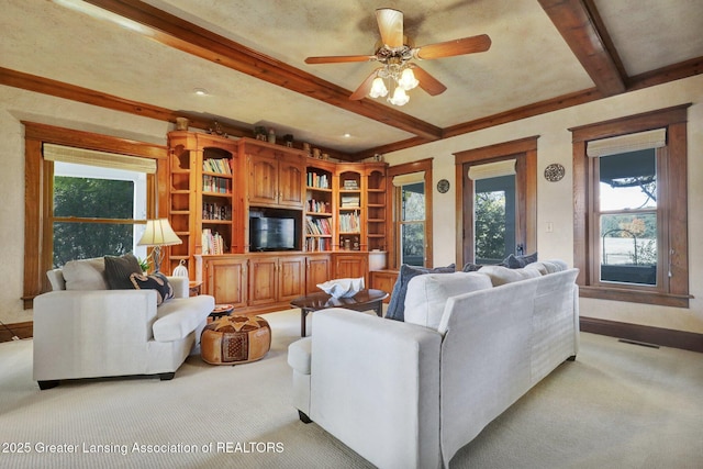 living room with light carpet, ceiling fan, and beamed ceiling