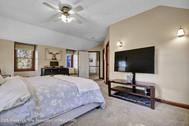 bedroom with carpet floors, vaulted ceiling, and ceiling fan