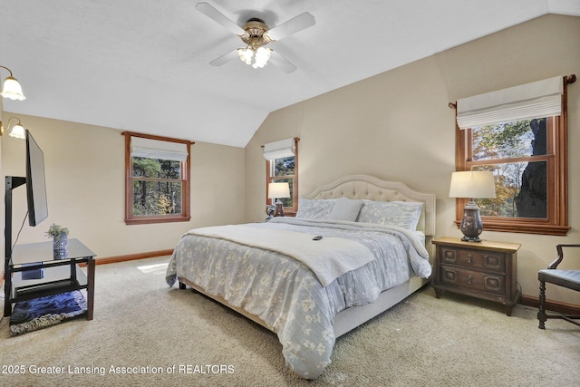 bedroom featuring lofted ceiling, ceiling fan, and carpet