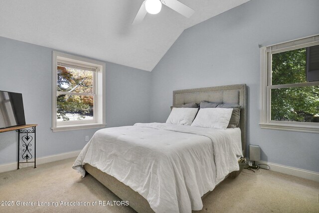 carpeted bedroom featuring lofted ceiling and ceiling fan