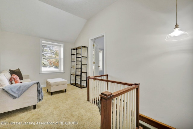 living area with lofted ceiling and carpet floors