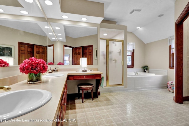 bathroom featuring vanity, lofted ceiling, and separate shower and tub