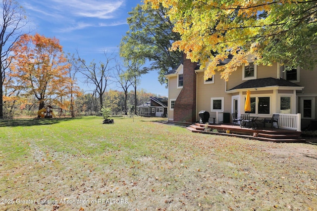 view of yard with a deck