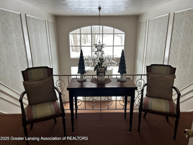 sitting room featuring a chandelier