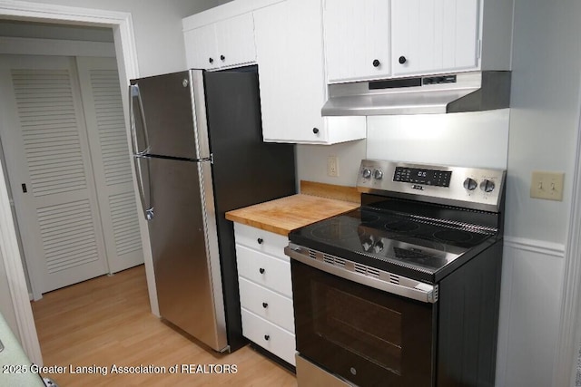 kitchen with white cabinetry, appliances with stainless steel finishes, and light hardwood / wood-style floors