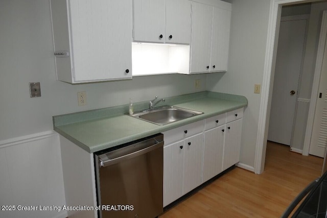 kitchen featuring white cabinetry, sink, dishwasher, and light wood-type flooring