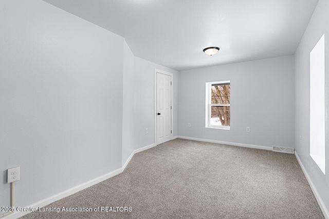 unfurnished room with carpet