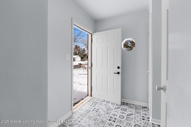 entrance foyer featuring ornamental molding