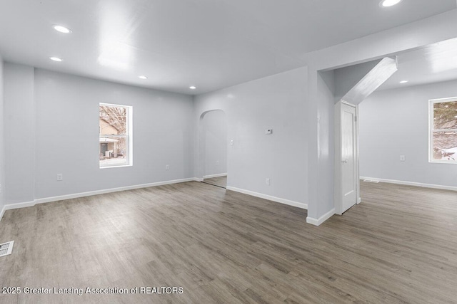 unfurnished room with wood-type flooring