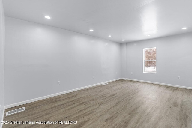 unfurnished room featuring hardwood / wood-style floors