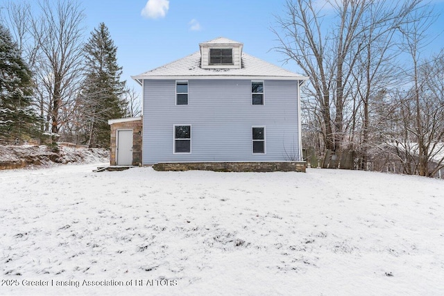 view of snow covered property