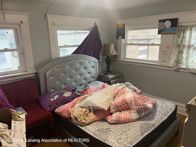 bedroom featuring multiple windows