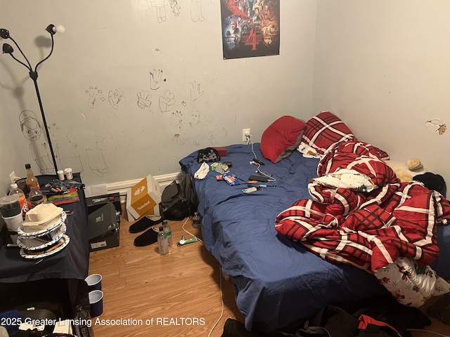 bedroom featuring hardwood / wood-style flooring