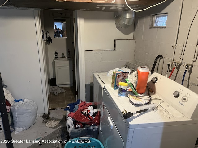 laundry area with independent washer and dryer