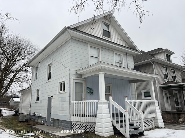 view of front of home featuring cooling unit and a porch