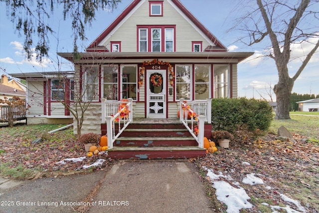 view of front of home featuring a sunroom