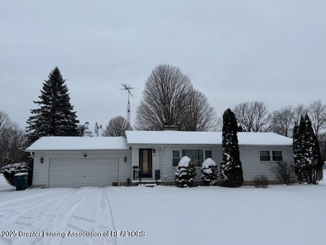 single story home featuring a garage