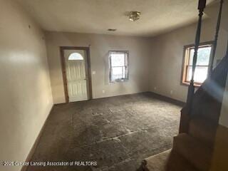 foyer featuring carpet floors