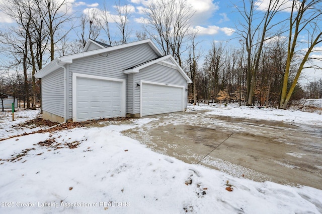 view of snow covered garage