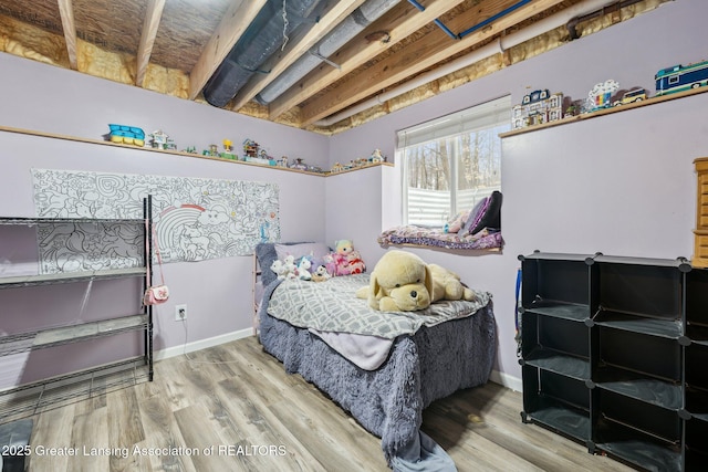 bedroom featuring hardwood / wood-style flooring