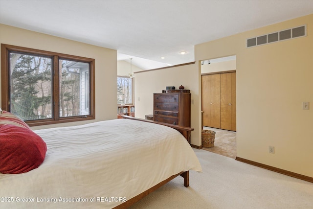 carpeted bedroom featuring vaulted ceiling