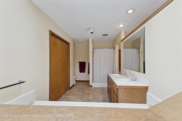 bathroom with vanity, a shower with curtain, and toilet