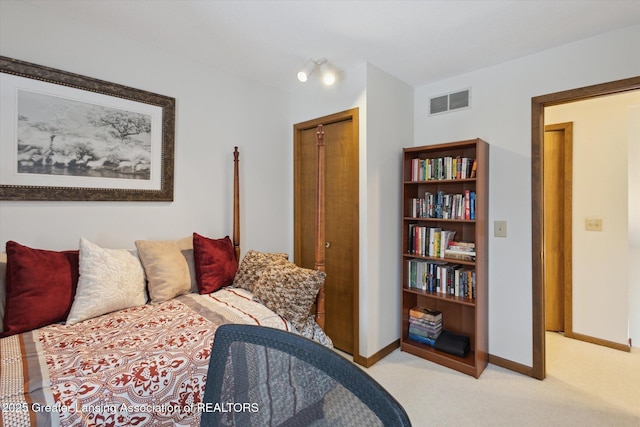 carpeted bedroom with a closet