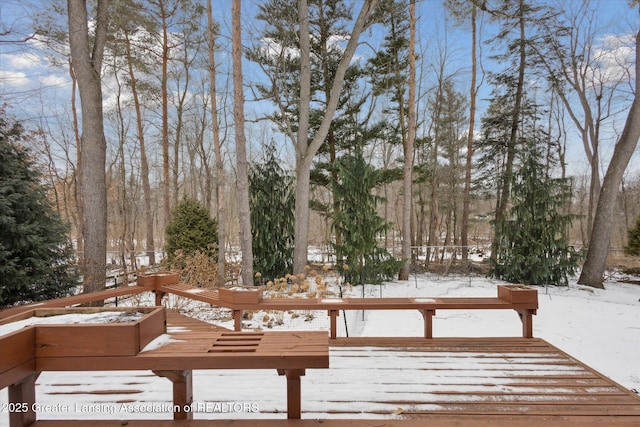 view of snow covered deck