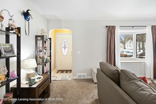 view of carpeted foyer