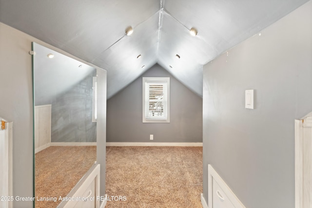 bonus room featuring light carpet and lofted ceiling