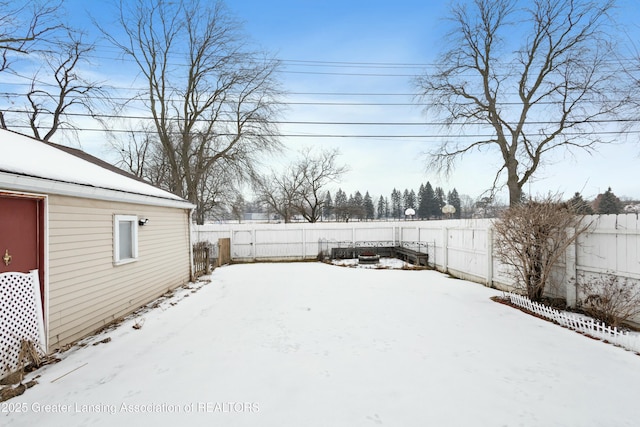 view of yard covered in snow