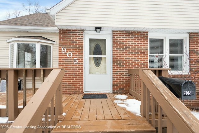 doorway to property featuring a wooden deck