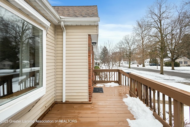 view of snow covered deck