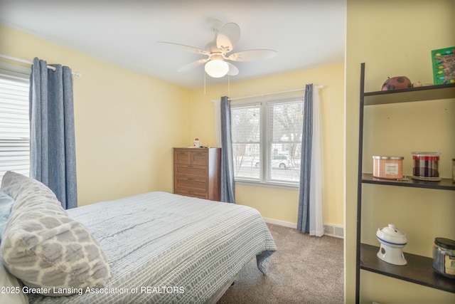 carpeted bedroom featuring ceiling fan