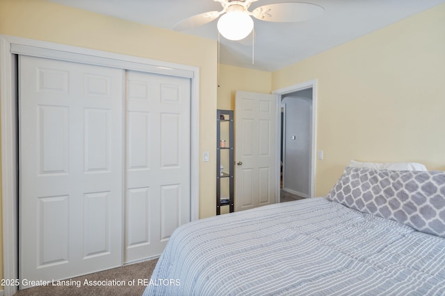 bedroom with carpet flooring, ceiling fan, and a closet