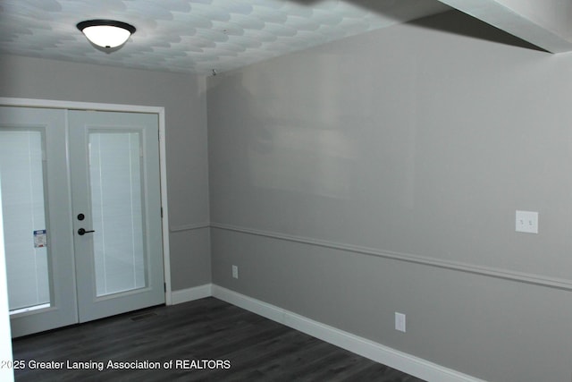 entrance foyer featuring french doors and dark hardwood / wood-style floors